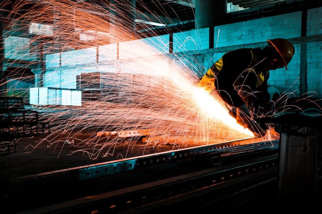 A Worker Cutting Metal